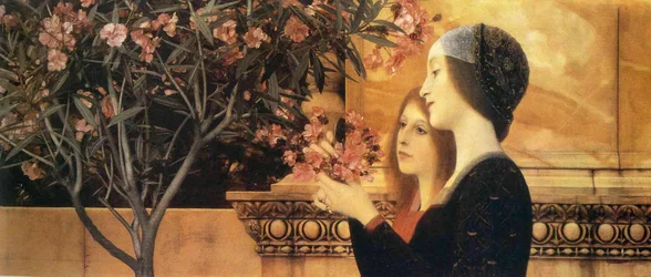 Zwei Mädchen mit einem Oleander